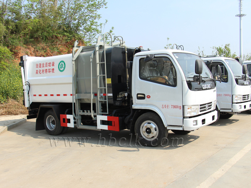 东风小多利卡7方侧装挂桶压缩垃圾车